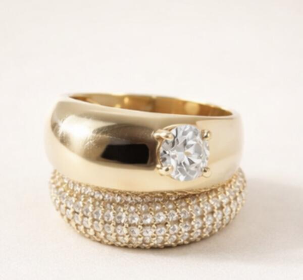 Gold dome solitaire ring stacked with a pave diamond band